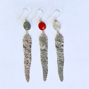 A selection of gumleaf inspired earrings made from sterling silver with gemstones